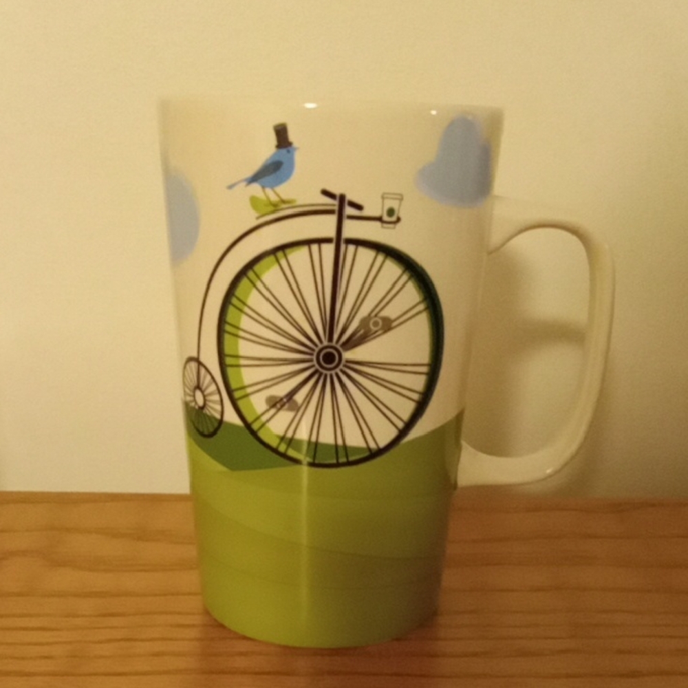 Starbucks White Ceramic Mug with Green Bicycle and Blue Bird Motif